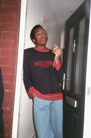 Oz wearing our Moschino Jeans knit 90's