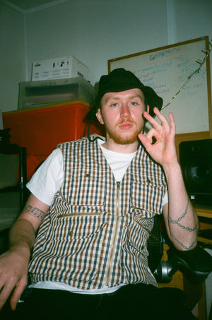 Shizz Mcnaughty wearing our archive Supreme x Aquascutum vest